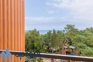a view of the ocean from the balcony of a resort at Apartament Pinea View - Aprent in Pobierowo
