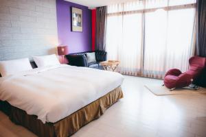 Postel nebo postele na pokoji v ubytování 823 Tourist Hotel