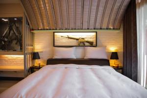 Postel nebo postele na pokoji v ubytování 823 Tourist Hotel