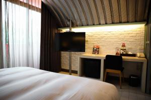 Postel nebo postele na pokoji v ubytování 823 Tourist Hotel