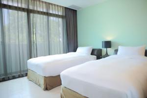 Postel nebo postele na pokoji v ubytování 823 Tourist Hotel