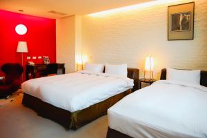 Postel nebo postele na pokoji v ubytování 823 Tourist Hotel