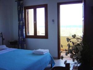 Postel nebo postele na pokoji v ubytování Dimitra Apartments