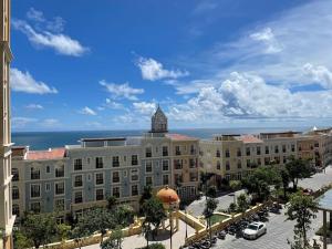 a large building with a clock tower on top of it at Loving family in Phu Quoc