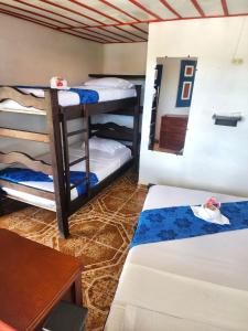 Un ou plusieurs lits superposés dans un hébergement de l'établissement Finca Hotel Las Palmeras