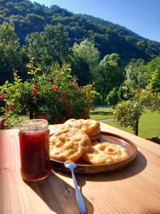 a plate of food on a table with a drink at Къща за гости Остриля in Cherni Vit