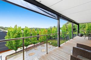 a large balcony with a view of trees at Bilsons Landing East in Daylesford +8 photos