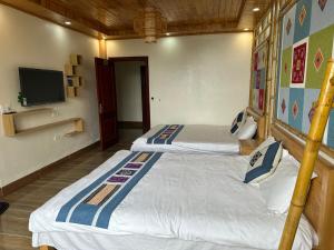 Postel nebo postele na pokoji v ubytování Huân Đậu Đậu Homestay