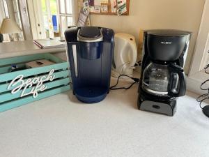 a coffee maker and a blender on a counter at Mandevilla Nevis in Cliftons