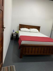 Rúm í herbergi á Nesan’s villa