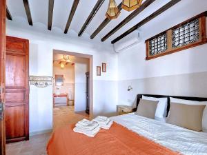 Een bed of bedden in een kamer bij Casa Rodriguillo