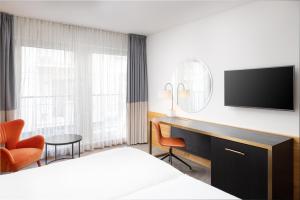Televízia a/alebo spoločenská miestnosť v ubytovaní K+K Hotel Opera