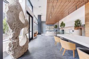 a lobby with a large rock sculpture on the floor at SoMa 1br w bike storage parking nr Bart SFO-1424 in San Francisco