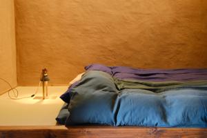 Ένα ή περισσότερα κρεβάτια σε δωμάτιο στο 1日1組限定の宿 旅館 土と糸 Ryokan Tsuchi to Ito