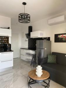a living room with a couch and a table at Villa Hvar II in Ivan Dolac +26 photos
