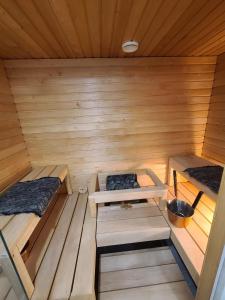 an inside view of a sauna with two beds at Cosy apartment with a relaxing sauna and a balcony in Helsinki