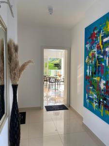 a vase in a room with a painting on the wall at Villa Hvar II in Ivan Dolac