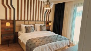Postel nebo postele na pokoji v ubytování BİLİRİS HOTEL