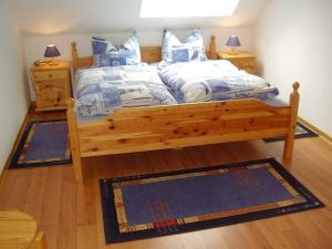 Postel nebo postele na pokoji v ubytování Ferienhaus in Dornumersiel 20-069