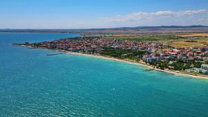 an aerial view of a city and the ocean at Family hotel Summer in Ravda