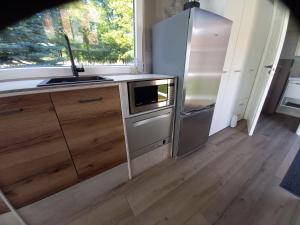 Kuchyň nebo kuchyňský kout v ubytování Tinyhaus in 16845 Manker mitten im Dorf tiny house