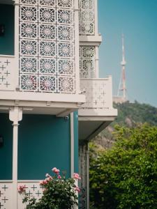 a building with a balcony with the eiffel tower in the background at Amante Narikala Boutique Hotel in Tbilisi City