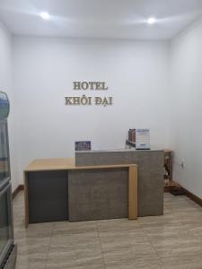 a sign for a hotel reception desk in a room at Khôi Đại Hotel in Buon Ma Thuot