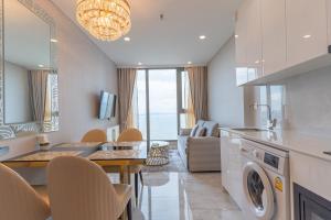 a kitchen and living room with a washer and dryer at Copacabana beach jomtien in Jomtien Beach