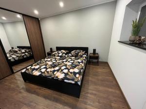 Apartament Willa Piotrowice tesisinde bir odada yatak veya yataklar