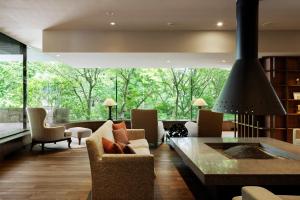 a living room with a couch and chairs and a table at Laforet Hakone Gora Yunosumika in Hakone