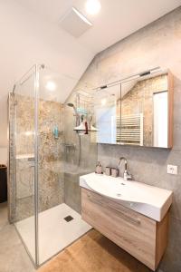 a bathroom with a sink and a shower at Sun Chalet in Schladming