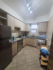 A kitchen or kitchenette at Chalet in Amwaj with a Sea view