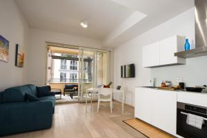 a kitchen and living room with a couch and a table at Ancient Rome in Rome