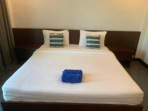 Postel nebo postele na pokoji v ubytování The C Hotel