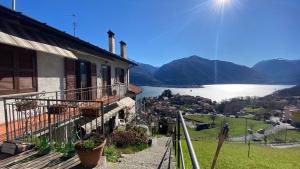 a house with a view of a lake and mountains at Holiday Home Delo - Cremia in Cremia
