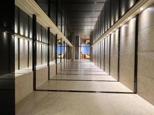 an empty hallway in a building with windows at Perla Marina in Nerja