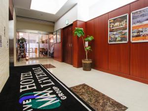 a store lobby with a welcome mat on the floor at HOTEL LiVEMAX BUDGET Hamamatsu-Ekimae in Hamamatsu +26 photos