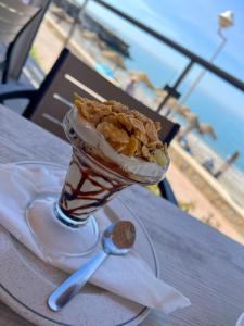 a dessert in a cup on a table at Perla Marina in Nerja