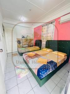 Katil atau katil-katil dalam bilik di Danial Homestay Semporna