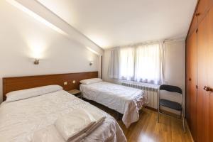 Letto o letti in una camera di La Solana Apartaments & Spa