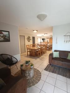 a living room with a couch and a table at Aventure Evasion in Chatuzange-le-Goubet