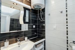 Koupelna v ubytování Charmy Studio Lux