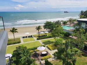 a view of the beach from a balcony of a resort at Mae Phim Holiday Escape Completely in Mae Pim