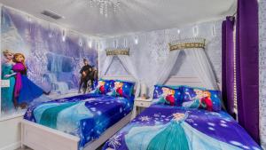 arozen bedroom with two beds and a disney mural at 1249 Challenge in Davenport