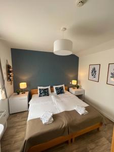 Postel nebo postele na pokoji v ubytování Zona Optimizma accommodation & SPA