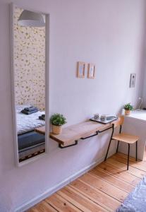 a dressing table in a room with a mirror at Artsy Room for 2 in Prenzlauer Berg - Ideal Stay in Shared Flat in Berlin