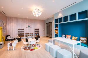 a childrens room with a table and chairs and a dining room at South Loop Studio w pool bbq gym nr Grant Park CHI-774 in Chicago