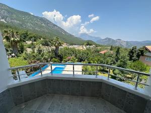 a balcony with a view of the mountains at Olympos Likya Apart Otel in Yenbey