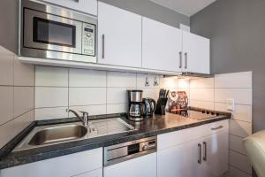 Kuchyň nebo kuchyňský kout v ubytování Haus Nordseeblick Wohnung 3