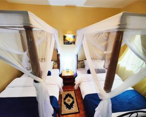 A bed or beds in a room at Springlands Hotel